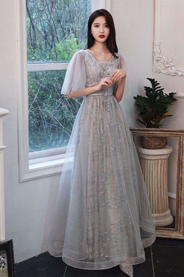 Soft V-neck, sheer tulle butterfly sleeves, sequin-embroidered bodice, and flowing A-line floor-length skirt