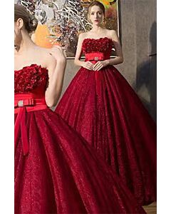 Elegant Strapless Red Lace Ball Gown with Floral Appliqué and Satin Bow Belt