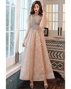 champagne tulle with a silver-beaded V-neck bodice