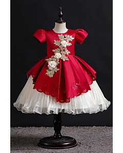 Elegant Red and White Dress with Floral Embellishments and Scalloped Hem.
