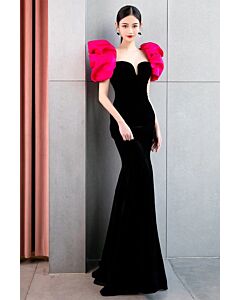 Glamorous Black Velvet Mermaid Gown with Vibrant Pink Ruffle Sleeves – Perfect for Red Carpet Events