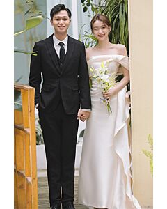 Ivory Off-Shoulder Bridal Gown with Draped Bow – Perfect for Modern Weddings