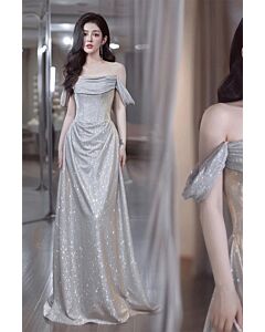 Shimmering Silver Off-Shoulder Gown with Draped Detail – Perfect for Formal Occasions and Red-Carpet Events
