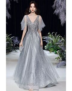 Shimmering Silver Tulle Gown with Embellished Bodice and Flutter Sleeves – Perfect for Evening Galas