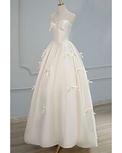 White Bow-Embellished Strapless Ball Gown – Perfect for Romantic Weddings