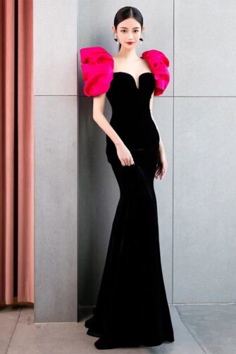 Glamorous Black Velvet Mermaid Gown with Vibrant Pink Ruffle Sleeves – Perfect for Red Carpet Events