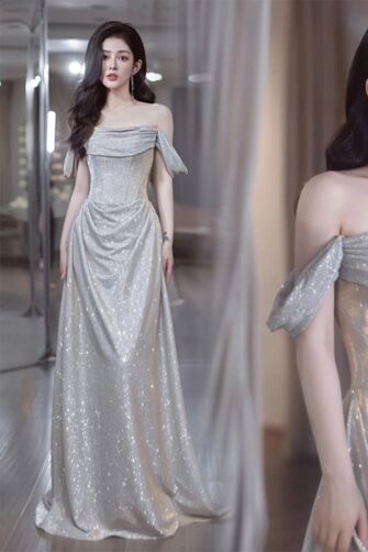 Shimmering Silver Off-Shoulder Gown with Draped Detail – Perfect for Formal Occasions and Red-Carpet Events