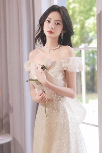 Enchanting Champagne Sequin Gown with Romantic Off-Shoulder Detail