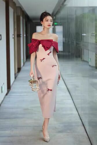 Chic Off-Shoulder Dress with Bow Accents and Elegant Red Overlay