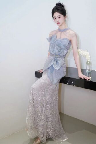 Elegant Ice Blue Mermaid Evening Gown - Luxurious Beaded Dress with Statement Bow for Engagements and Formal Events