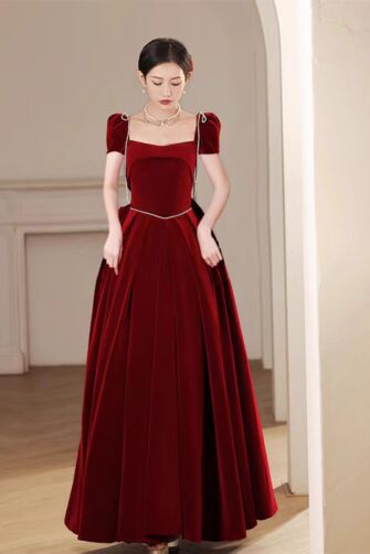 Burgundy Velvet Square Neck Gown with Puff Sleeves and Pleated Skirt – Perfect for Formal Events and Galas