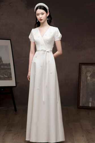 Elegant White Wrap Dress with Embellished Details and Chic Tie Belt
