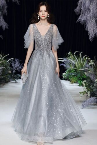 Shimmering Silver Tulle Gown with Embellished Bodice and Flutter Sleeves – Perfect for Evening Galas