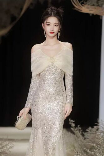 Glamorous Off-Shoulder Gold Sequined Gown with Elegant Cape Overlay for Special Occasions