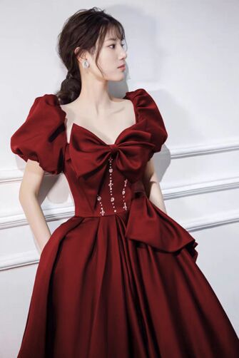 Elegant Red Off-Shoulder Gown with Bow and Crystal Detailing