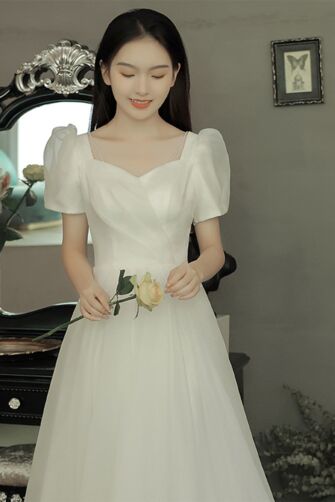 Graceful Ivory Puff-Sleeve Gown – Elegant A-Line Dress with Delicate Shoulder Straps