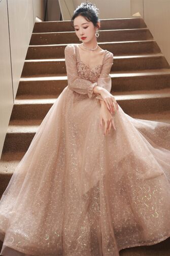 Sparkling Blush Tulle Gown with Sequined Bodice and Sheer Sleeves – Perfect for Formal Occasions