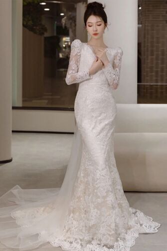 Timeless Lace Long-Sleeve Wedding Gown with Elegant Train and Delicate Detail