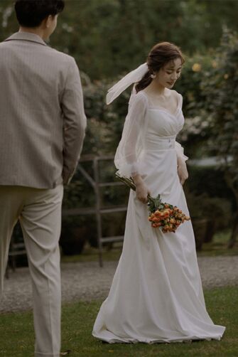 Elegant Ivory Bridal Gown – Romantic Off-Shoulder Dress with Sheer Sleeves for Wedding Ceremonies