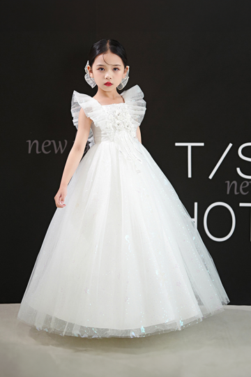 Sparkling White Tulle Dress with Ruffled Sleeves and Floral Embellishments.