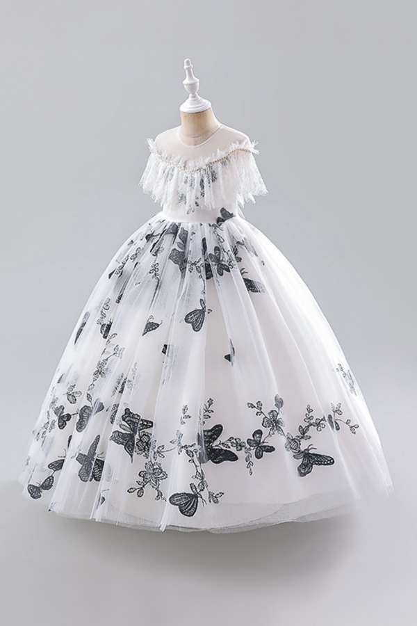Elegant White Tulle Dress with Black Floral Embroidery and Ruffled Off-Shoulder Detail.