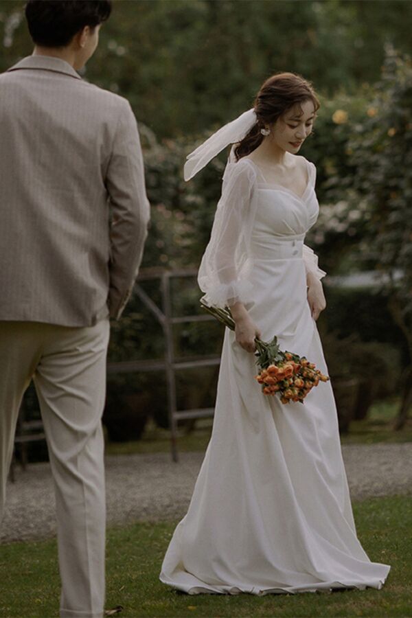 Elegant Ivory Bridal Gown – Romantic Off-Shoulder Dress with Sheer Sleeves for Wedding Ceremonies